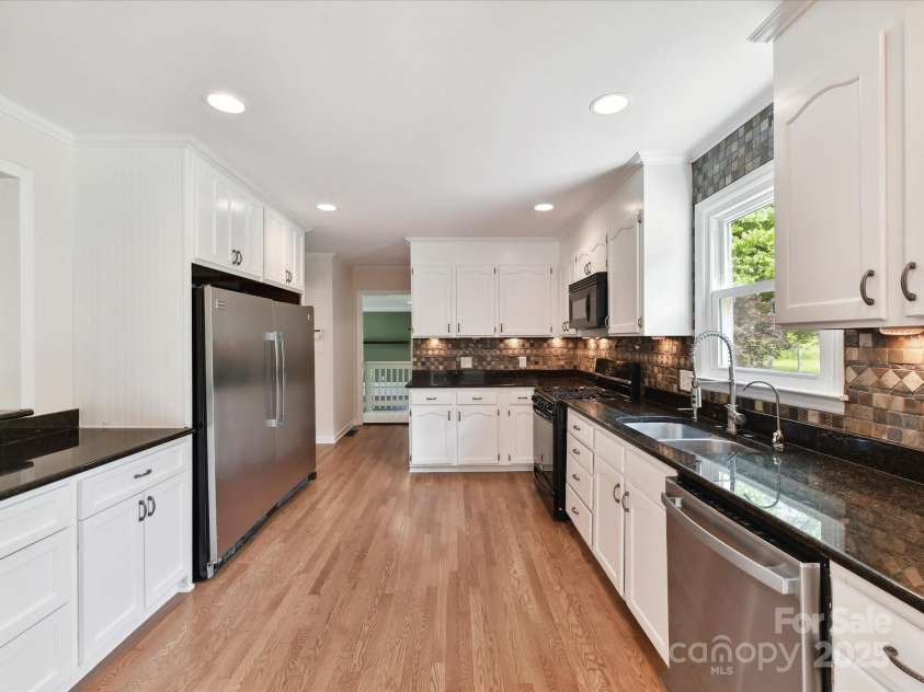 915 Gate Road, Monroe, NC 28112.  MLS# CAR4245908, YatesRealty ID 14460. This kitchen is huge! With lots of counter and cabinet space.