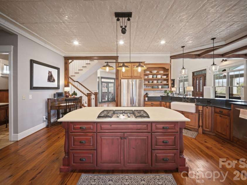 29 Bonnie Brae Drive, Weaverville, NC 28787.  MLS# CAR4352485, YatesRealty ID 14478. Kitchen island with vented gas range
