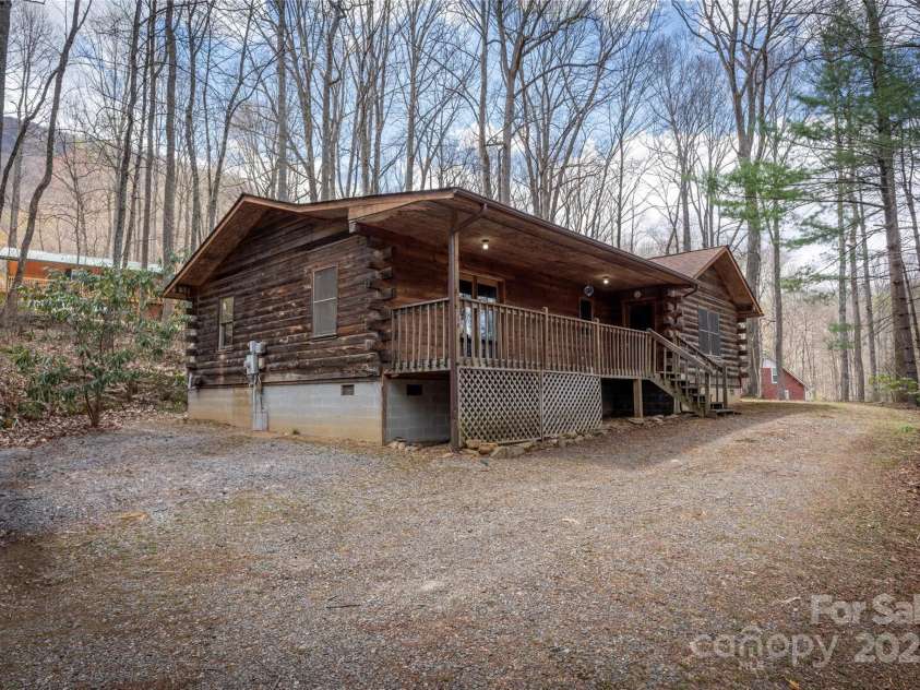 398 Locust Drive, Maggie Valley, NC 28751.  MLS# CAR4243493, YatesRealty ID 14479. Log Cabin on .78 acre evel lot