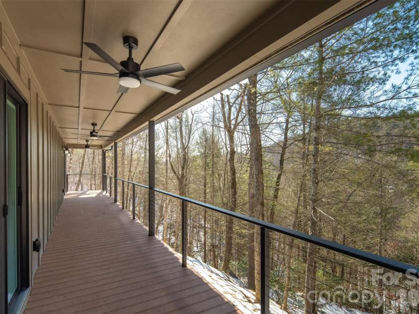 114 Woodpecker Road, Purlear, NC 28665.  MLS# CAR4346014, YatesRealty ID 14480. Covered Porch - Main Level