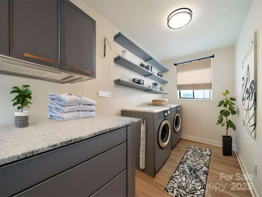 3918 Dahlia Drive, Harrisburg, NC 28075.  MLS# CAR4240653, YatesRealty ID 14484. Laundry staged for representation