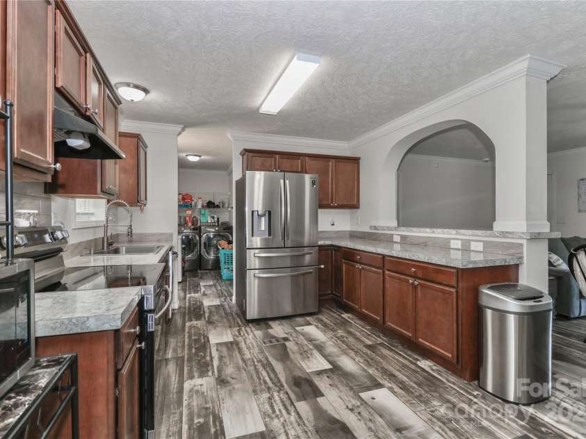 119 Marietta Road, Mooresville, NC 28117.  MLS# CAR4253281, YatesRealty ID 14489. Arch over serving bar