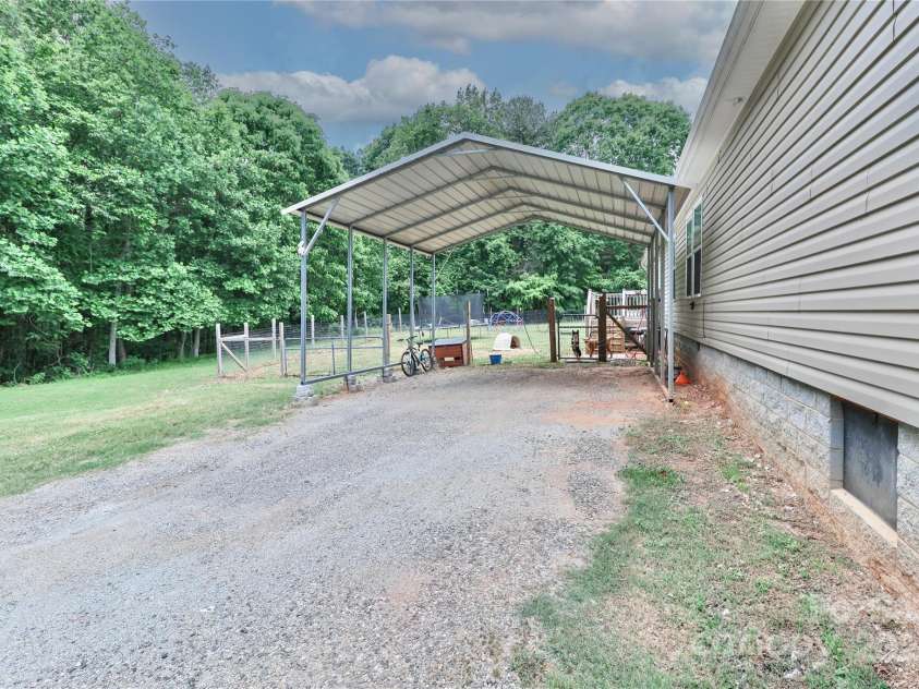 119 Marietta Road, Mooresville, NC 28117.  MLS# CAR4253281, YatesRealty ID 14489. Tall carport!