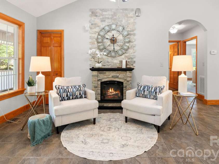1235 Chatham Lane, Salisbury, NC 28146.  MLS# CAR4367157, YatesRealty ID 14490. Cozy electric fireplace with stack stone tile and mantle.