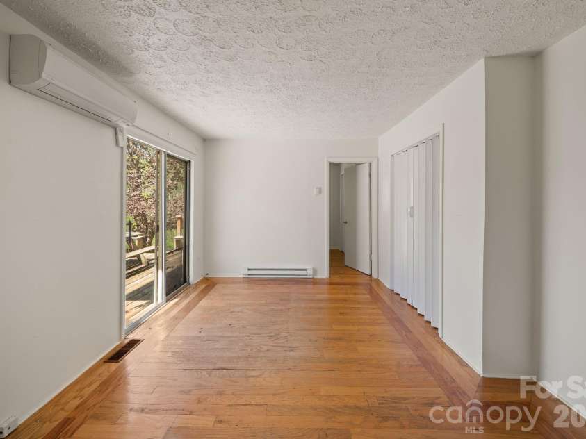 290 Hookers Gap Road, Candler, NC 28715.  MLS# CAR4373451, YatesRealty ID 14496. Second flex living area in main home