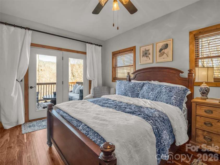 32 Zebulon Lane, Mars Hill, NC 28754.  MLS# CAR4336470, YatesRealty ID 1450. Retreat into the primary bedroom and enjoy coffee in bed while taking in the mountain view. Access to the deck is an added bonus and would be a great place to watch the sunset!