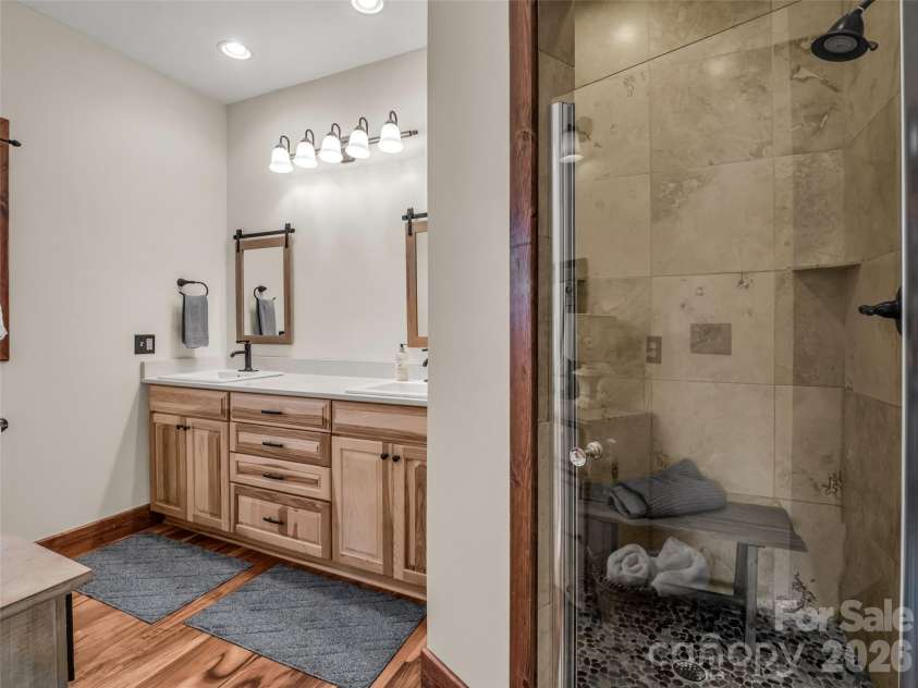 32 Zebulon Lane, Mars Hill, NC 28754.  MLS# CAR4336470, YatesRealty ID 1450. The ensuite primary bathroom provides privacy for the occupant.