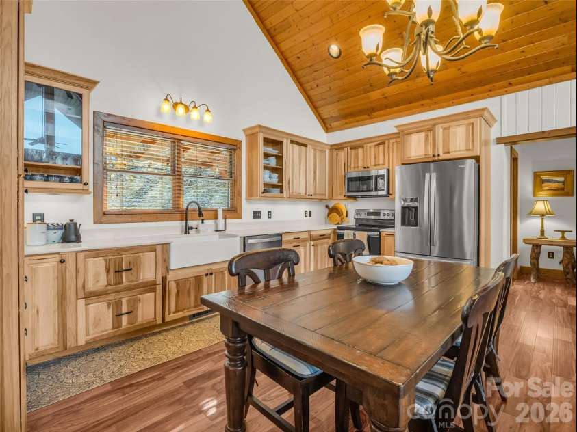 32 Zebulon Lane, Mars Hill, NC 28754.  MLS# CAR4336470, YatesRealty ID 1450. The recently renovated kitchen showcases gorgeous hardwood cabinetry and countertops, beautifully paired with stainless steel appliances.
