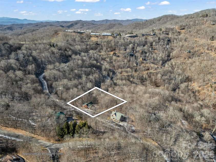 32 Zebulon Lane, Mars Hill, NC 28754.  MLS# CAR4336470, YatesRealty ID 1450. This property is just a 2 minute drive to the Wolf Laurel Golf and Country Club and Fitness Center.