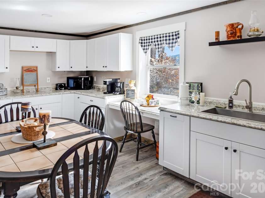 872 Mountainside Drive, Waynesville, NC 28786.  MLS# CAR4348882, YatesRealty ID 14503. Lower level kitchenette and eating area