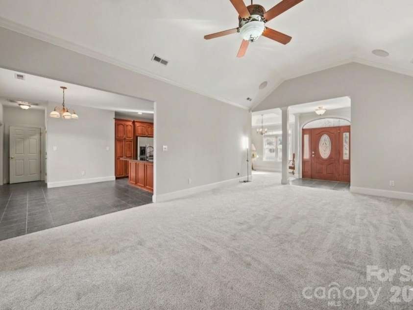 5106 Pond Bluff Drive, Monroe, NC 28112.  MLS# CAR4358314, YatesRealty ID 14505. Living room flows effortlessly into the Kitchen and Dining area