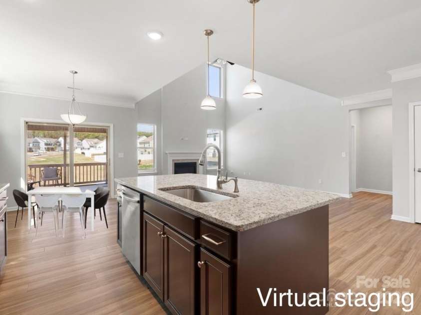 110 Lantern Acres Drive, Mooresville, NC 28115.  MLS# CAR4242068, YatesRealty ID 14516. Open view - kitchen and family room (Virtual stage)