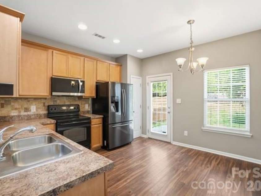 1204 Afternoon Sun Road, Matthews, NC 28104.  MLS# CAR4364140, YatesRealty ID 14517. Kitchen and Dining Area
