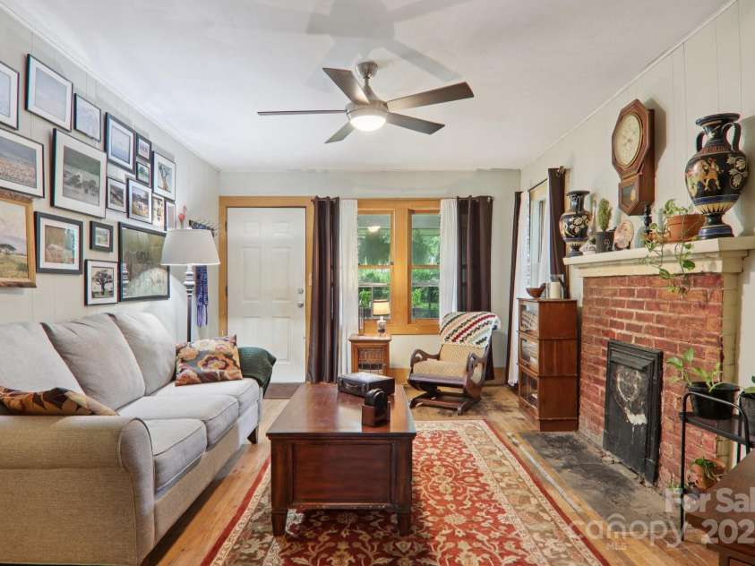 68 1/2 Nevada Avenue, Asheville, NC 28806.  MLS# CAR4280825, YatesRealty ID 1453. Bright living room with historical character