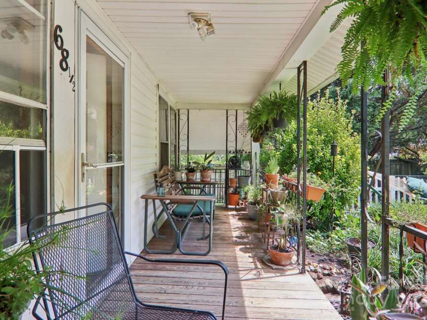 68 1/2 Nevada Avenue, Asheville, NC 28806.  MLS# CAR4280825, YatesRealty ID 1453. Front porch for swings or rocking chairs!
