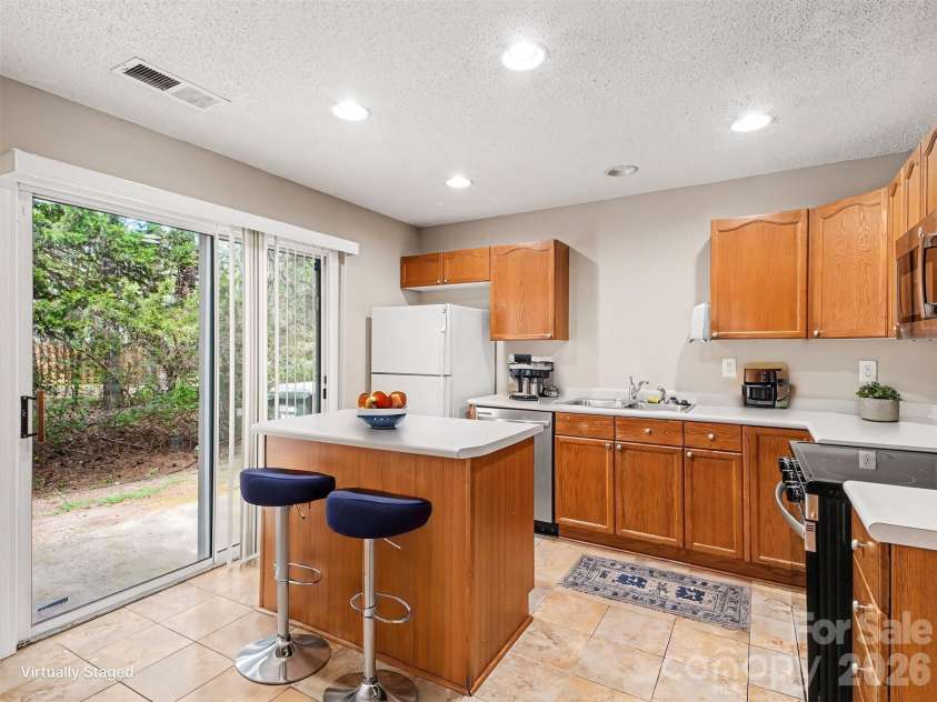 2132 Preakness Court, Charlotte, NC 28273.  MLS# CAR4370965, YatesRealty ID 14533. Kitchen with island virtually staged