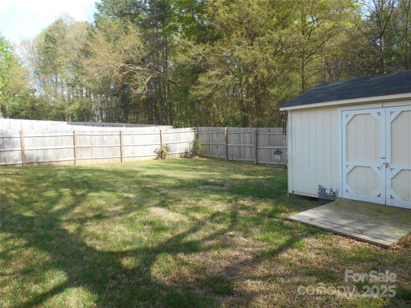 158 Margaret Turner Road, Charlotte, NC 28216.  MLS# CAR4243785, YatesRealty ID 1455. Fenced in rear yard with shed.