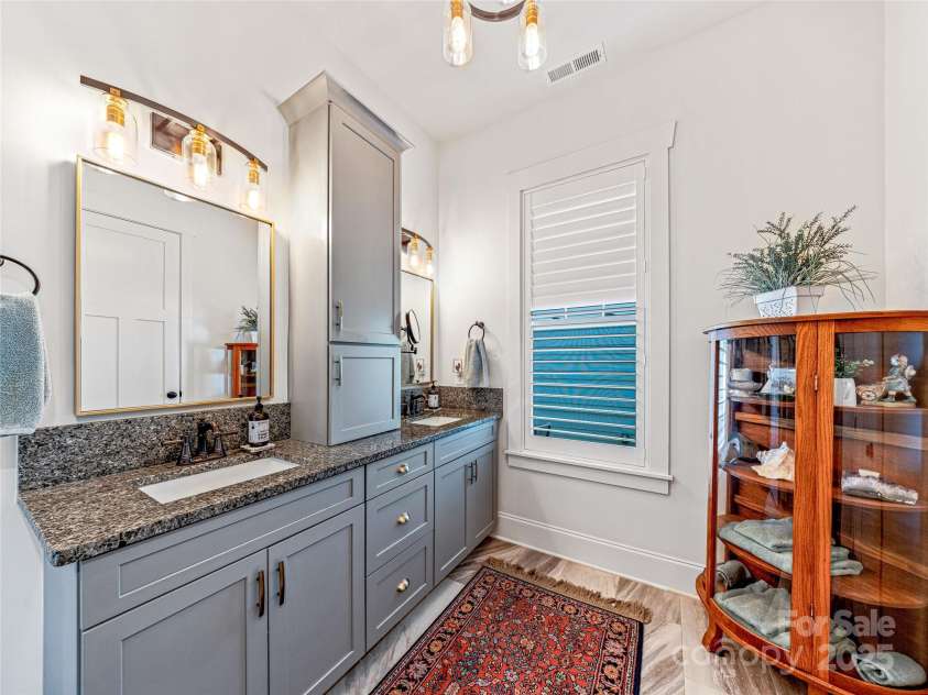294 Main Street, Brevard, NC 28712.  MLS# CAR4260783, YatesRealty ID 14562. 2 sinks and plenty of storage in primary bath
