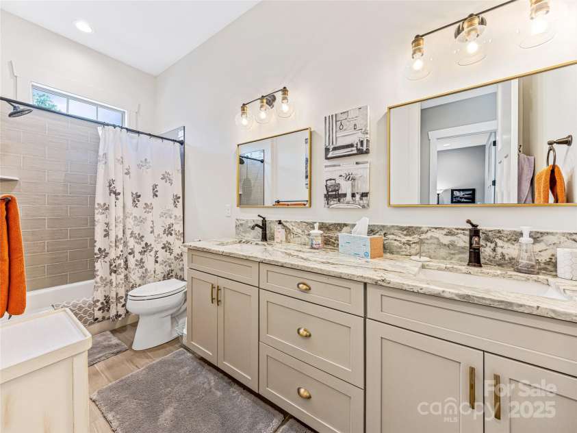 294 Main Street, Brevard, NC 28712.  MLS# CAR4260783, YatesRealty ID 14562. Guest bath, double sinks, shower-tub