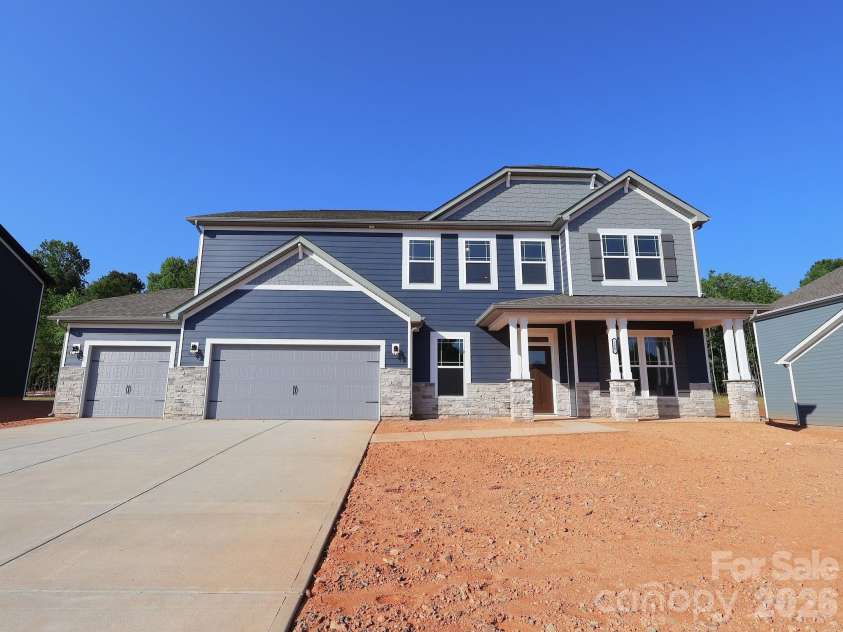 225 Amber Glen Drive, Locust, NC 28097.  MLS# CAR4373458, YatesRealty ID 14565. Exterior. Home will receive sod once sold