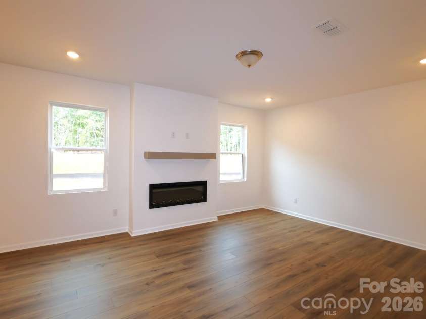 225 Amber Glen Drive, Locust, NC 28097.  MLS# CAR4373458, YatesRealty ID 14565. Family room