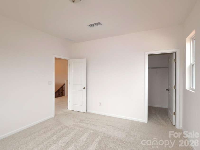 225 Amber Glen Drive, Locust, NC 28097.  MLS# CAR4373458, YatesRealty ID 14565. Secondary bedroom