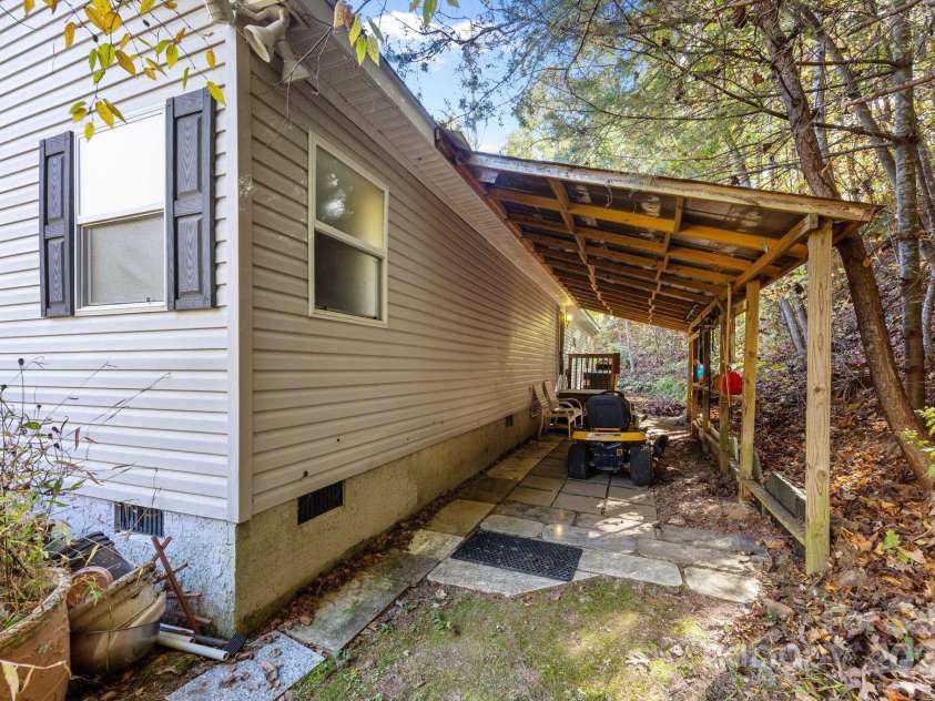 74 Davis Chapel Road, Candler, NC 28715.  MLS# CAR4311937, YatesRealty ID 1457. Back porch/carport