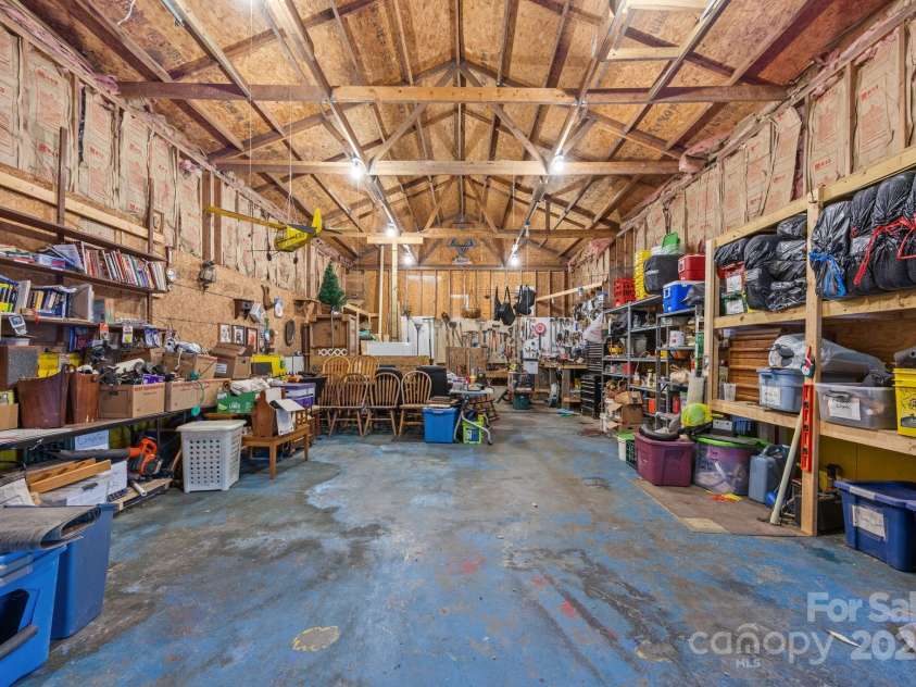 74 Davis Chapel Road, Candler, NC 28715.  MLS# CAR4311937, YatesRealty ID 1457. Massive garage