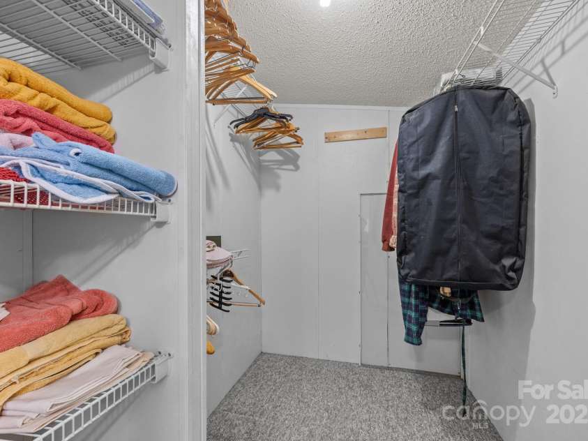 74 Davis Chapel Road, Candler, NC 28715.  MLS# CAR4311937, YatesRealty ID 1457. Primary closet