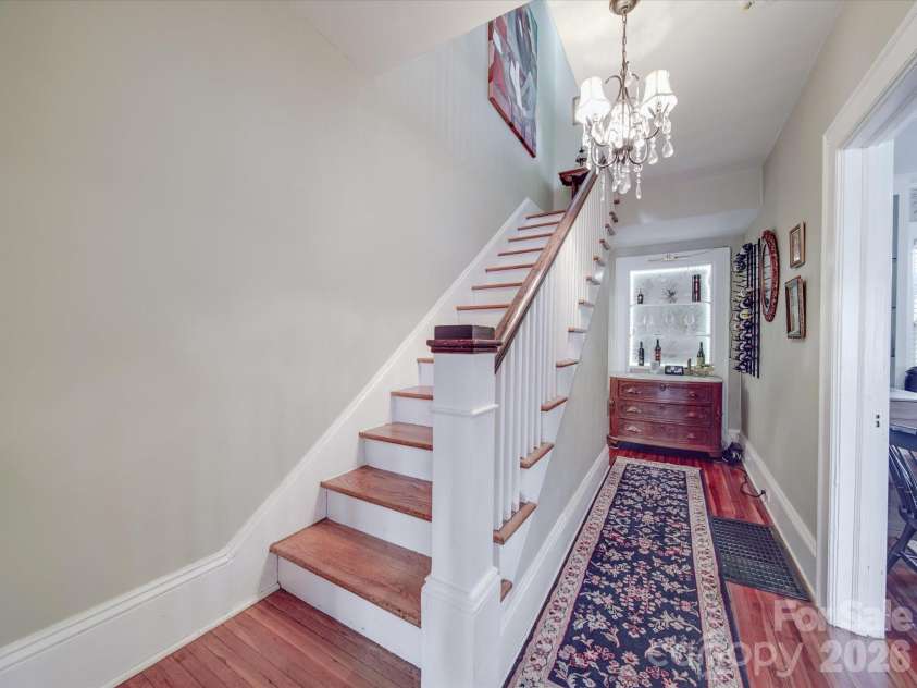 907 Edgewood Circle, Gastonia, NC 28052.  MLS# CAR4373699, YatesRealty ID 14571. Staircase and Built-In Bar/Display Area