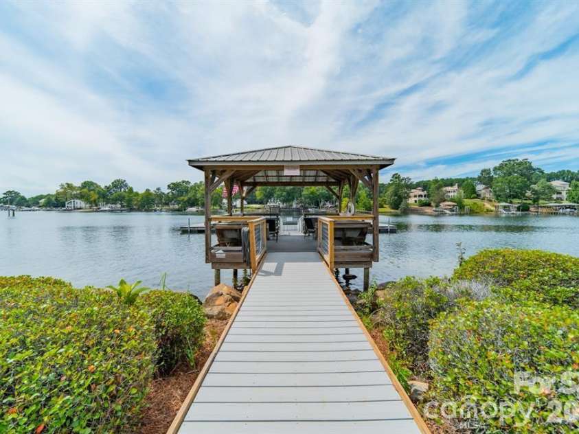 7822 Village Harbor Drive, Cornelius, NC 28031.  MLS# CAR4351828, YatesRealty ID 14578. Boat dock with common covered cabanna area.  Relax.  Sip on something. Enjoy the view.  You might feel like you are in your own oasis.