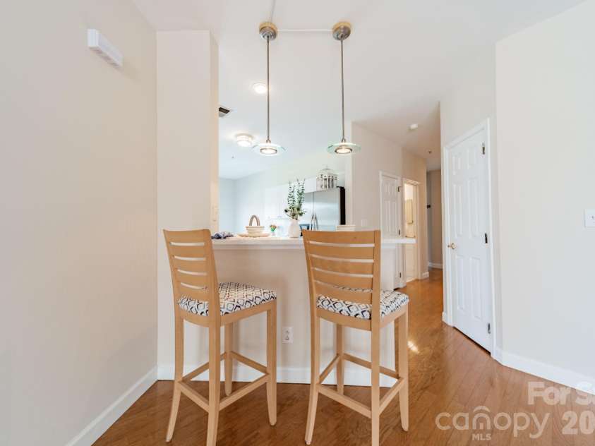 7822 Village Harbor Drive, Cornelius, NC 28031.  MLS# CAR4351828, YatesRealty ID 14578. Or ... for a quick bite or to keep someone company while they are working at the sink, pull up a stool at the counter.