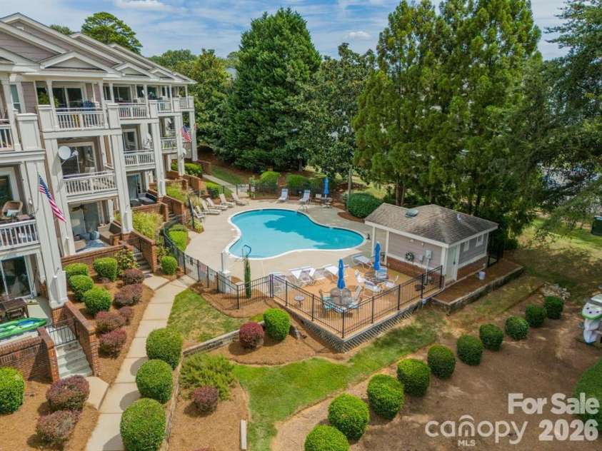 7822 Village Harbor Drive, Cornelius, NC 28031.  MLS# CAR4351828, YatesRealty ID 14578. Pool serves this building plus the adjacent building of 2-bedroom condos