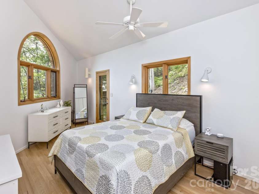 212 Chestnut Forest Road, Fairview, NC 28730.  MLS# CAR4372045, YatesRealty ID 14587. Primary bedroom with exit to private deck