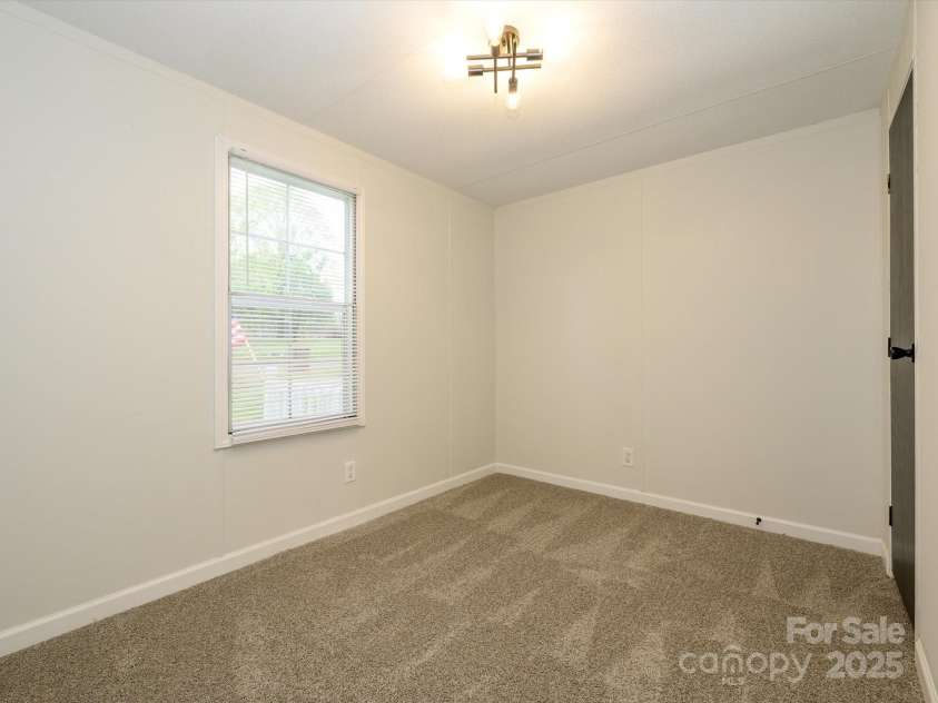 105 Mountain Brook Drive, Bessemer City, NC 28016.  MLS# CAR4237868, YatesRealty ID 14590. Another view of bedroom with new carpet.