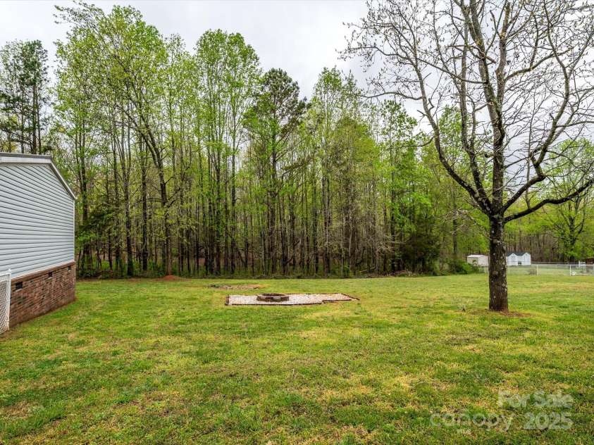 105 Mountain Brook Drive, Bessemer City, NC 28016.  MLS# CAR4237868, YatesRealty ID 14590. Another view of huge fenced side yard to the right of the home.