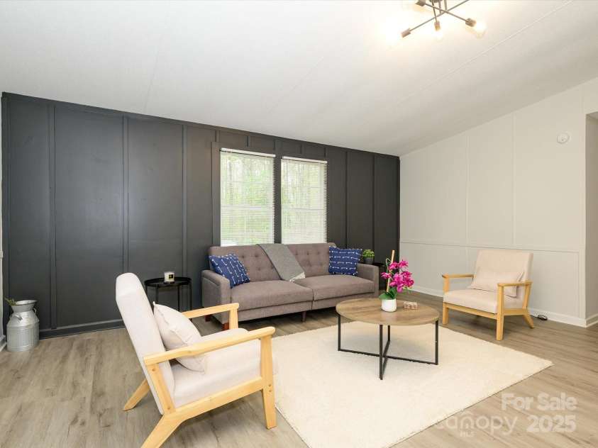 105 Mountain Brook Drive, Bessemer City, NC 28016.  MLS# CAR4237868, YatesRealty ID 14590. Board and batten accent wall in living room.
