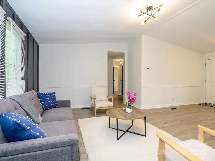 105 Mountain Brook Drive, Bessemer City, NC 28016.  MLS# CAR4237868, YatesRealty ID 14590. View from family room into hallway.