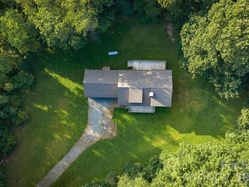 486 Hunter-Lysik Way, Laurel Springs, NC 28644.  MLS# CAR4325096, YatesRealty ID 14597. Beautiful Wooded Setting