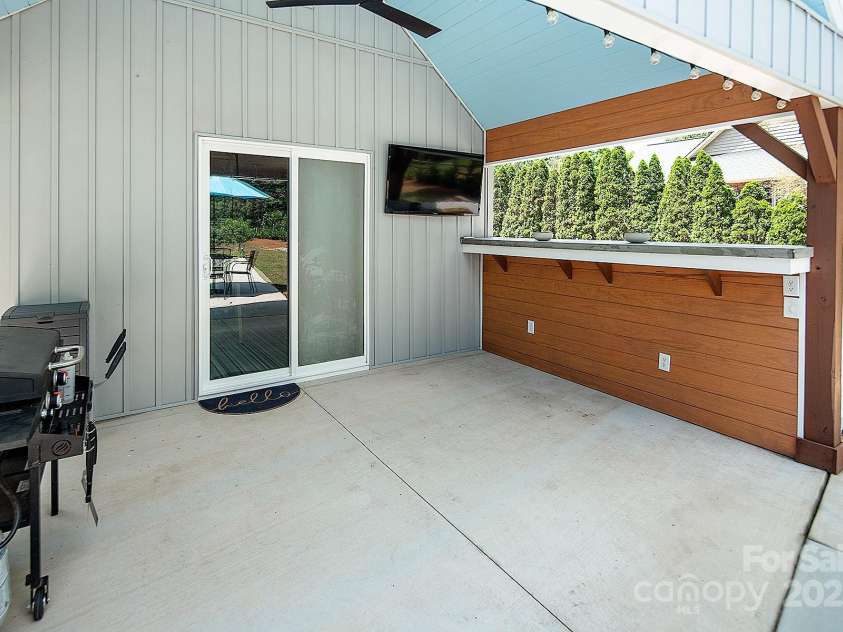 105 Chippewa Trail, China Grove, NC 28023.  MLS# CAR4255896, YatesRealty ID 14598. Pool House Entrance with Covered Patio and Bar