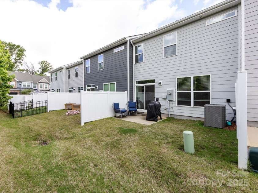 2141 Bexar Trail, Matthews, NC 28105.  MLS# CAR4255990, YatesRealty ID 14621. Backyard/patio area