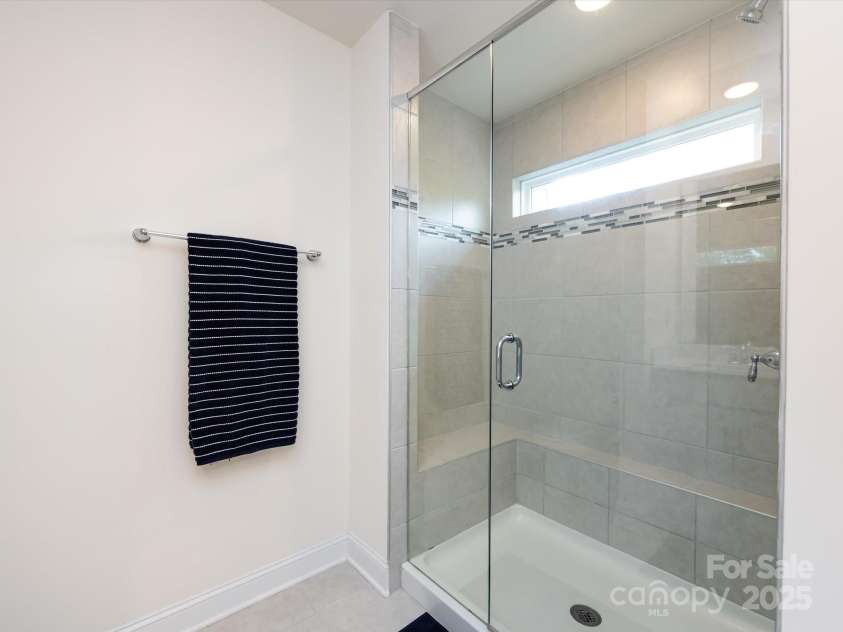 2141 Bexar Trail, Matthews, NC 28105.  MLS# CAR4255990, YatesRealty ID 14621. Enclosed tiled walk in shower