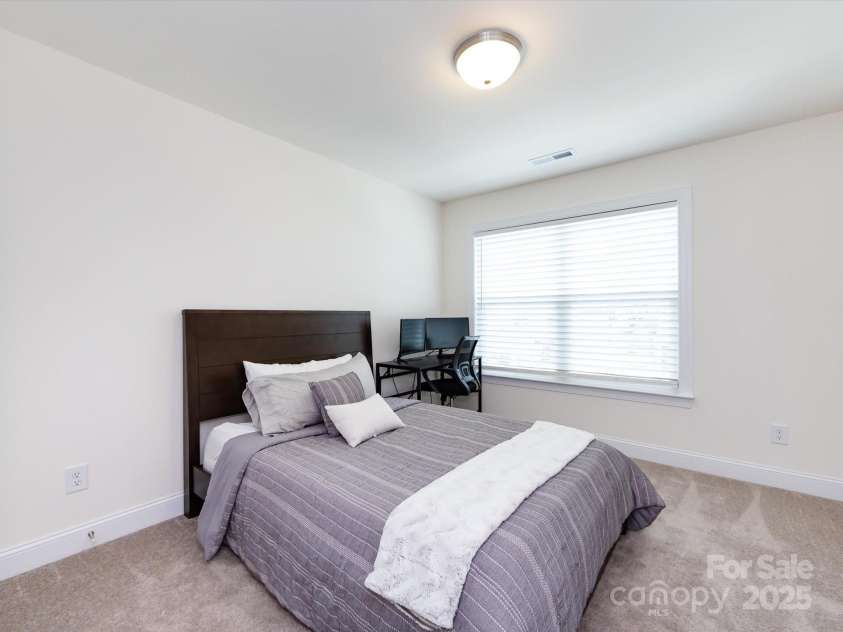 2141 Bexar Trail, Matthews, NC 28105.  MLS# CAR4255990, YatesRealty ID 14621. Secondary bedroom