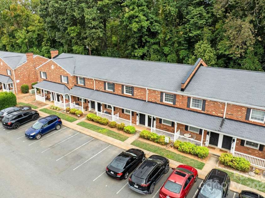 1215 Green Oaks Lane, Charlotte, NC 28205.  MLS# CAR4256711, YatesRealty ID 14622. Brick condo lives like a townhome with a private, wooded backyard.