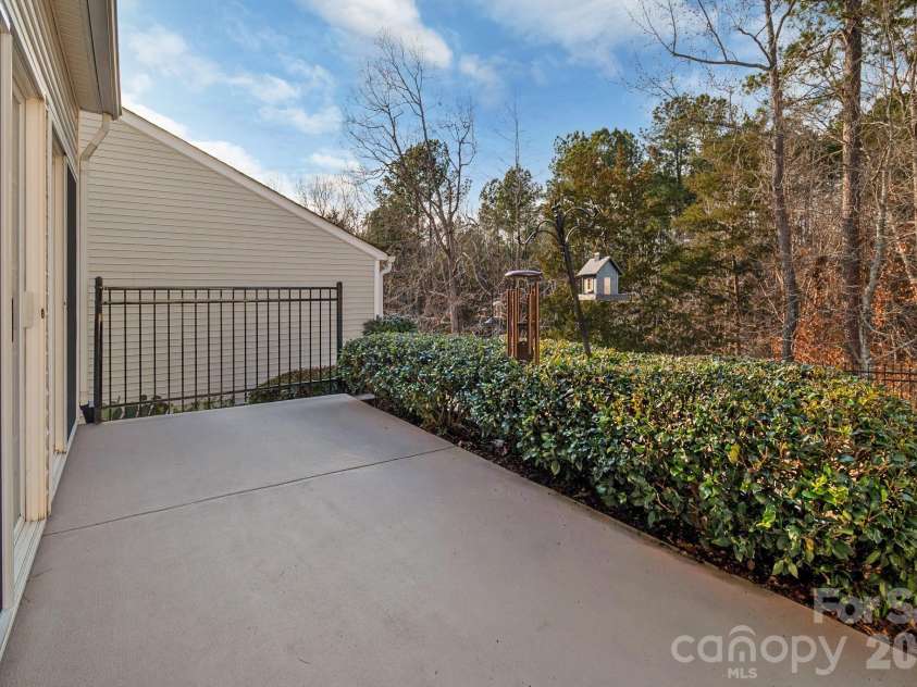 3037 Azalea Drive, Fort Mill, SC 29707.  MLS# CAR4342633, YatesRealty ID 14632. Added landscaping for additional privacy off patio