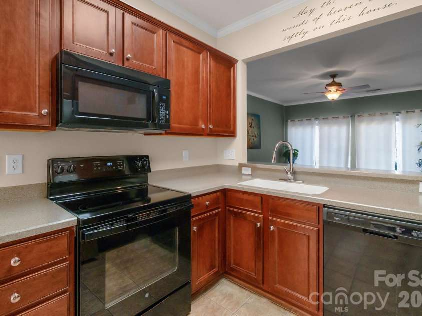 3037 Azalea Drive, Fort Mill, SC 29707.  MLS# CAR4342633, YatesRealty ID 14632. Corian countertops and matching applicances