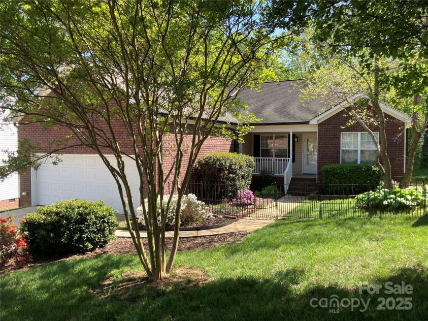 2339 Wednesbury Court, Kannapolis, NC 28083.  MLS# CAR4257609, YatesRealty ID 14641. Cozy cottage feel with covered porch, secret garden for your fur babies to explore.