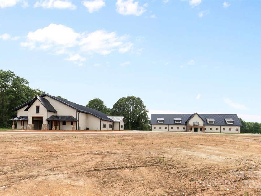1822 Irby Road, Monroe, NC 28112.  MLS# CAR4259856, YatesRealty ID 14646. Barn and Arena on the NorthWest Corner of the Property