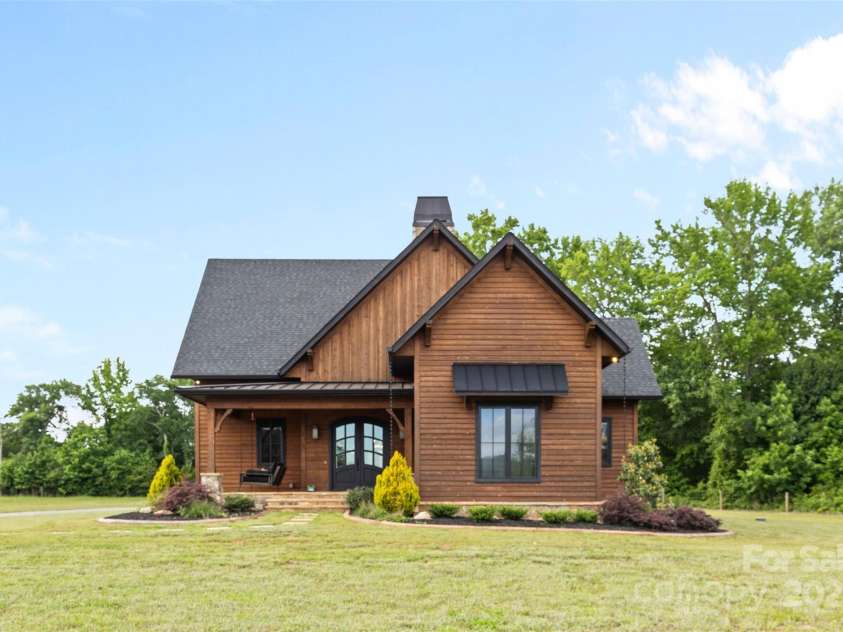 1822 Irby Road, Monroe, NC 28112.  MLS# CAR4259856, YatesRealty ID 14646. Guest Home with Garage and Screened Porch