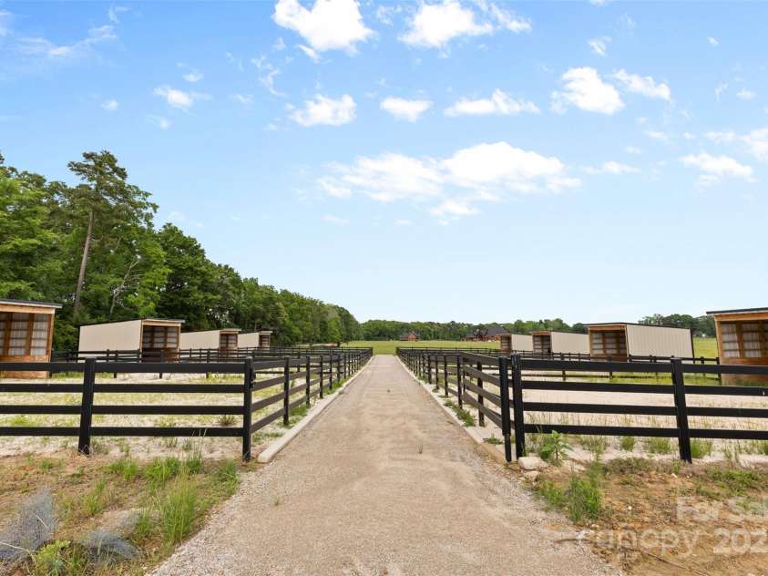 1822 Irby Road, Monroe, NC 28112.  MLS# CAR4259856, YatesRealty ID 14646. Paddocks for all the horses